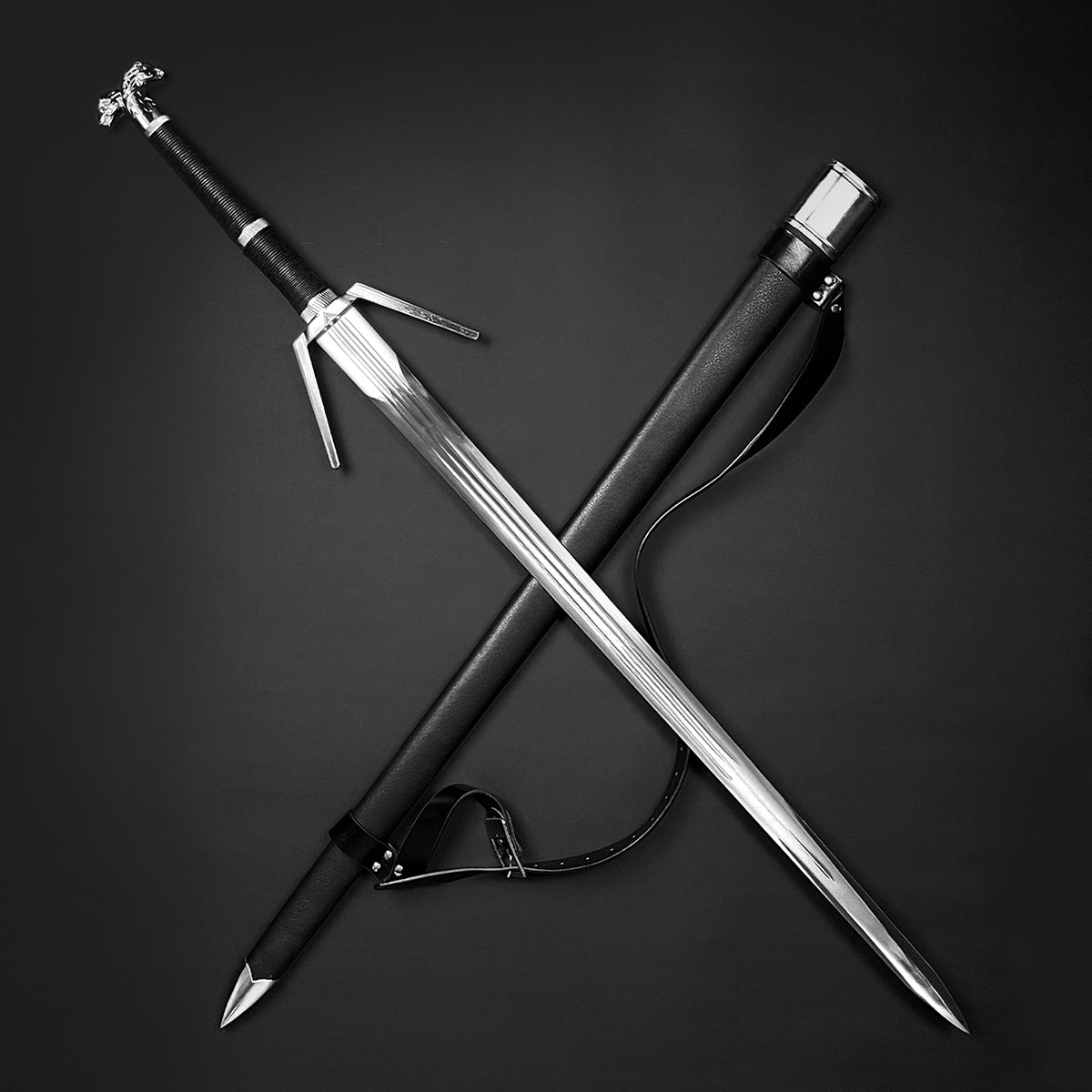 Amphisbaena medieval sword by Knights Collection crossed with leather scabbard on black background