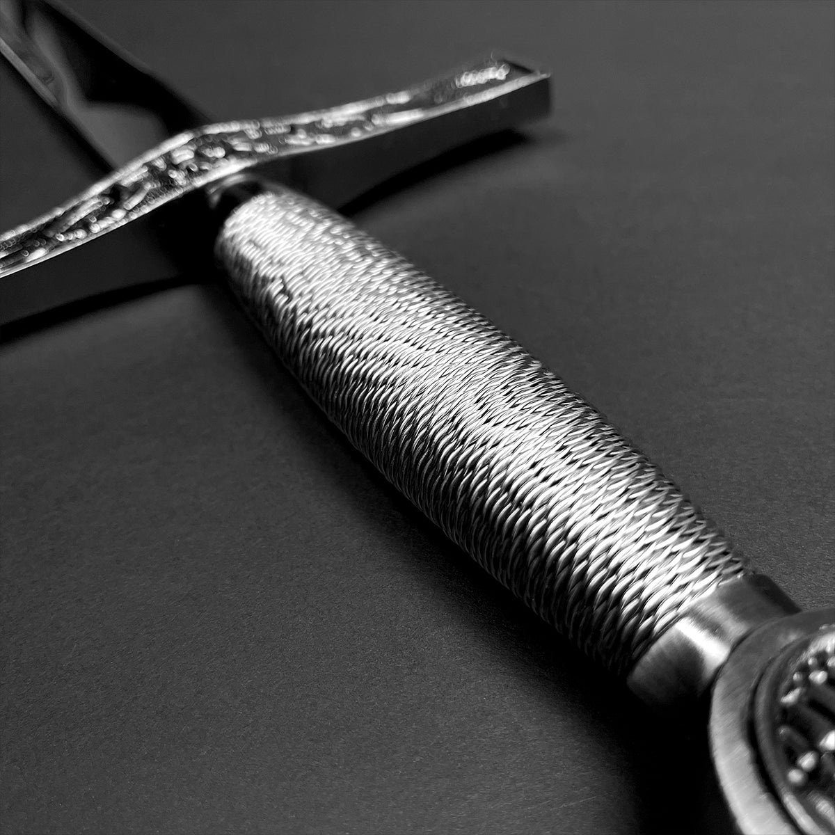 Chivalry one-hand medieval sword from Knight's Collection with intricate grip design and detailed crossguard