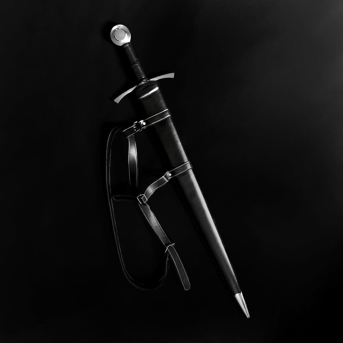 Knights Collection hand-forged damascus medieval sword in black leather scabbard with shoulder harness and steel pommel