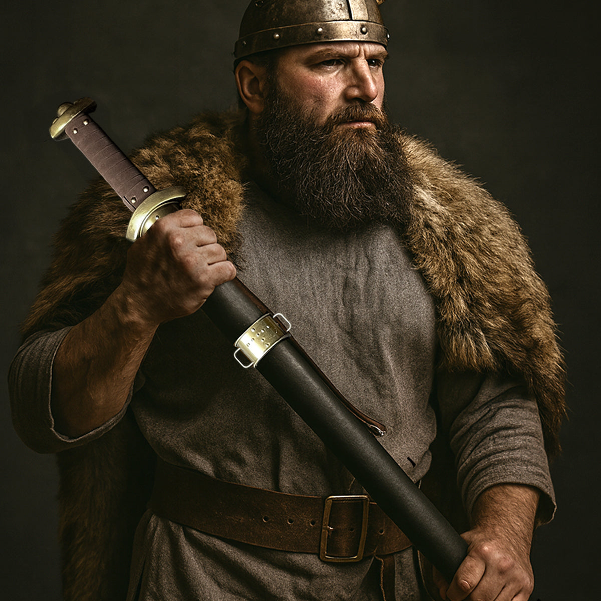 Knights Collection Godfrid the Battle-Born Viking Sword held by a warrior in a fur cloak and helmet