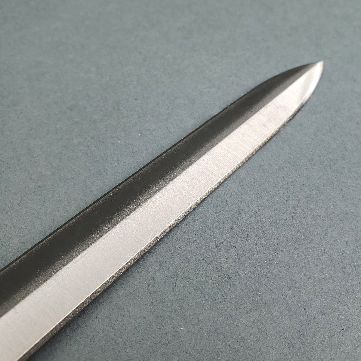 Close-up of Knights Templar short sword blade with sharp polished steel edge from Knight's Collection