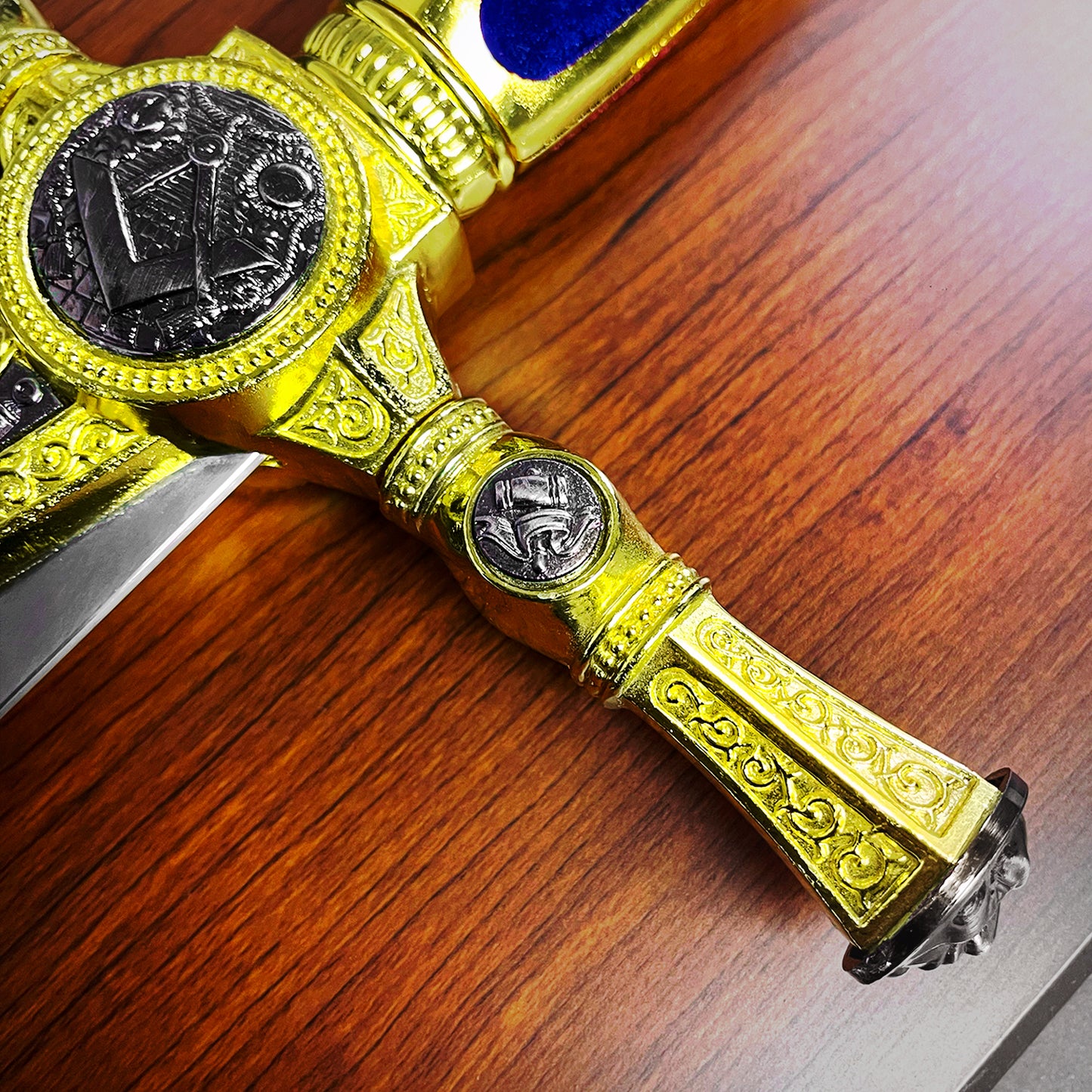 Knights Collection freemason decorative sword ornate gold hilt with Masonic symbols on wooden table