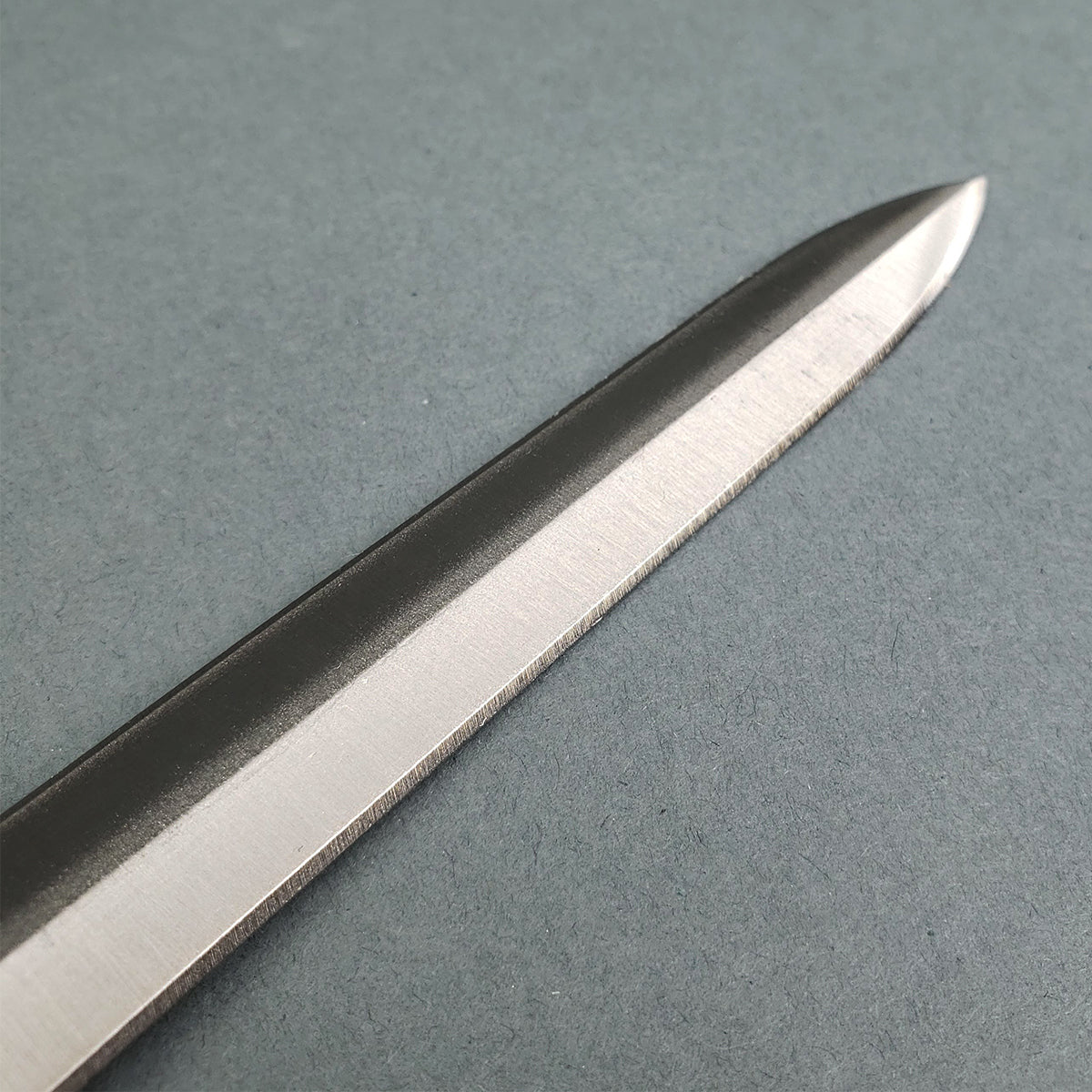 Knights Templar sword for sale polished steel double edged blade close up showing central ridge and tapered tip