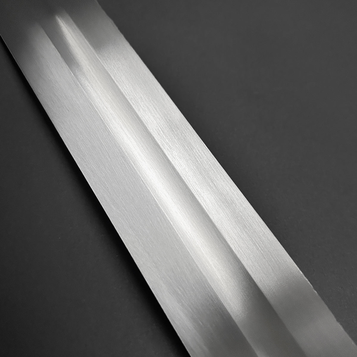 Knights Collection hand-forged viking longsword polished blade detail with central fuller on dark background