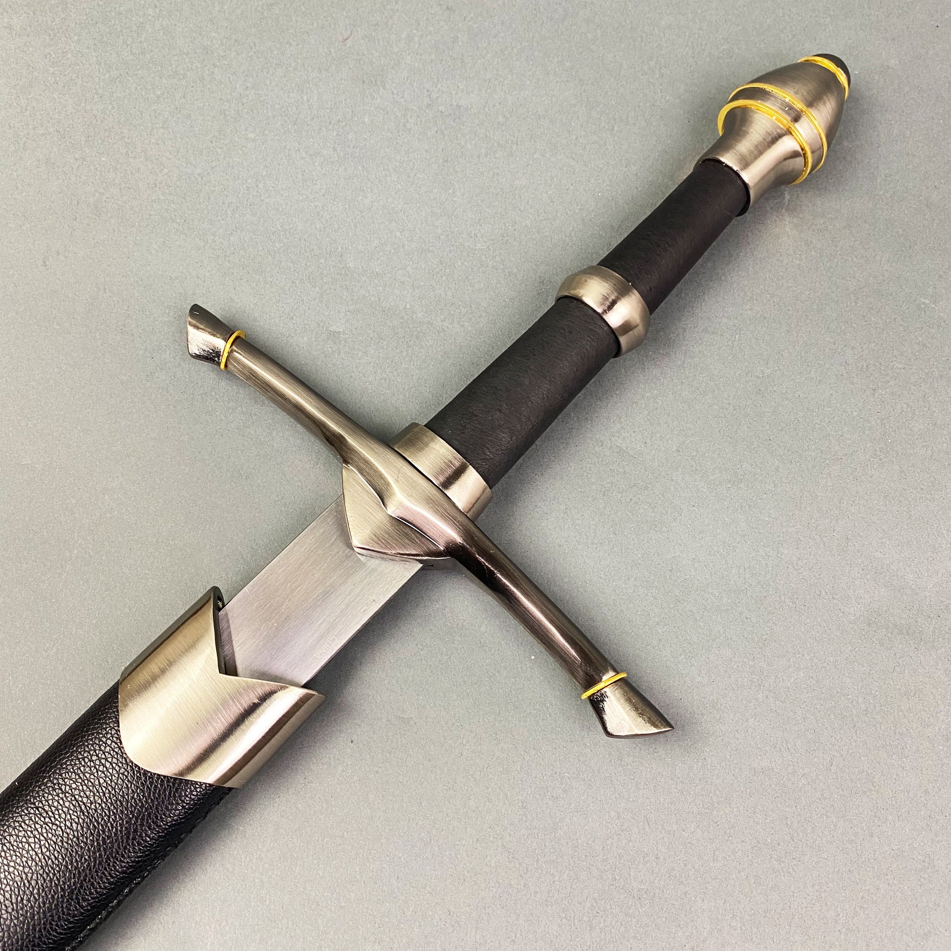 One-Hand Knight Medieval Sword with a sleek blade and detailed hilt design from Knight's Collection.
