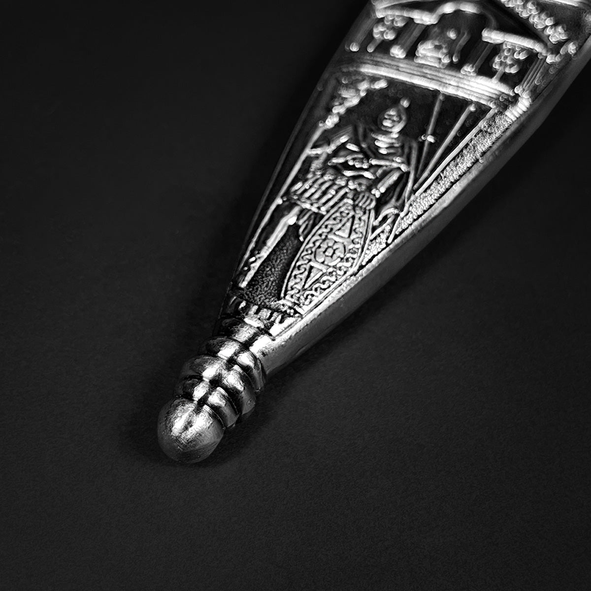 Close up of ornate engraved scabbard tip and detailing for Knights Collection Roman Gladius Medieval Sword
