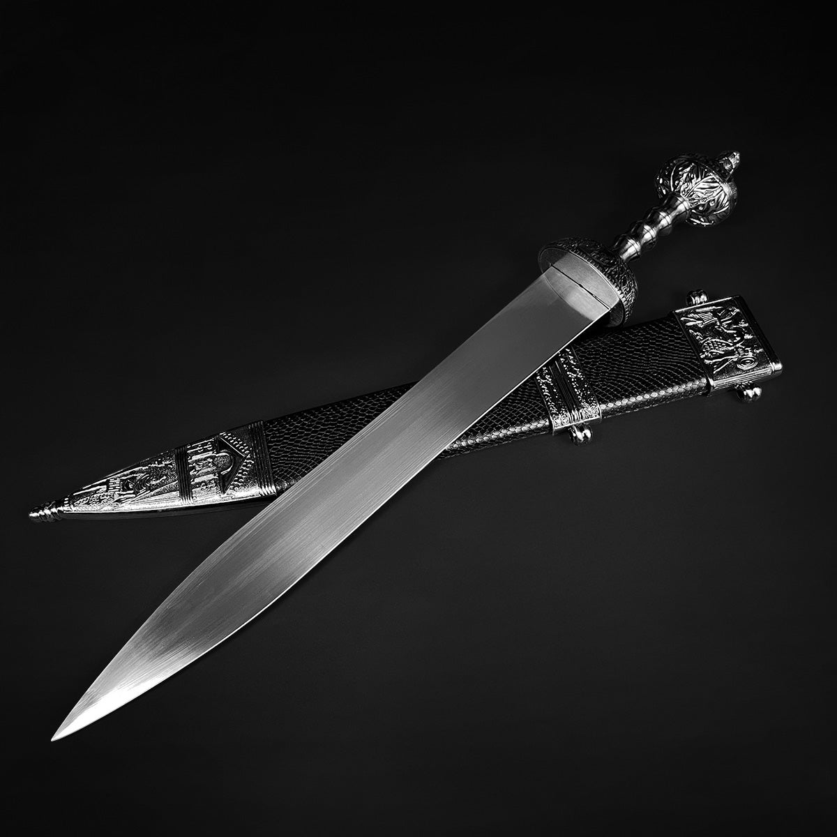 Knights Collection Roman Gladius Medieval Sword . Ornate steel blade with decorative hilt and detailed scabbard on black