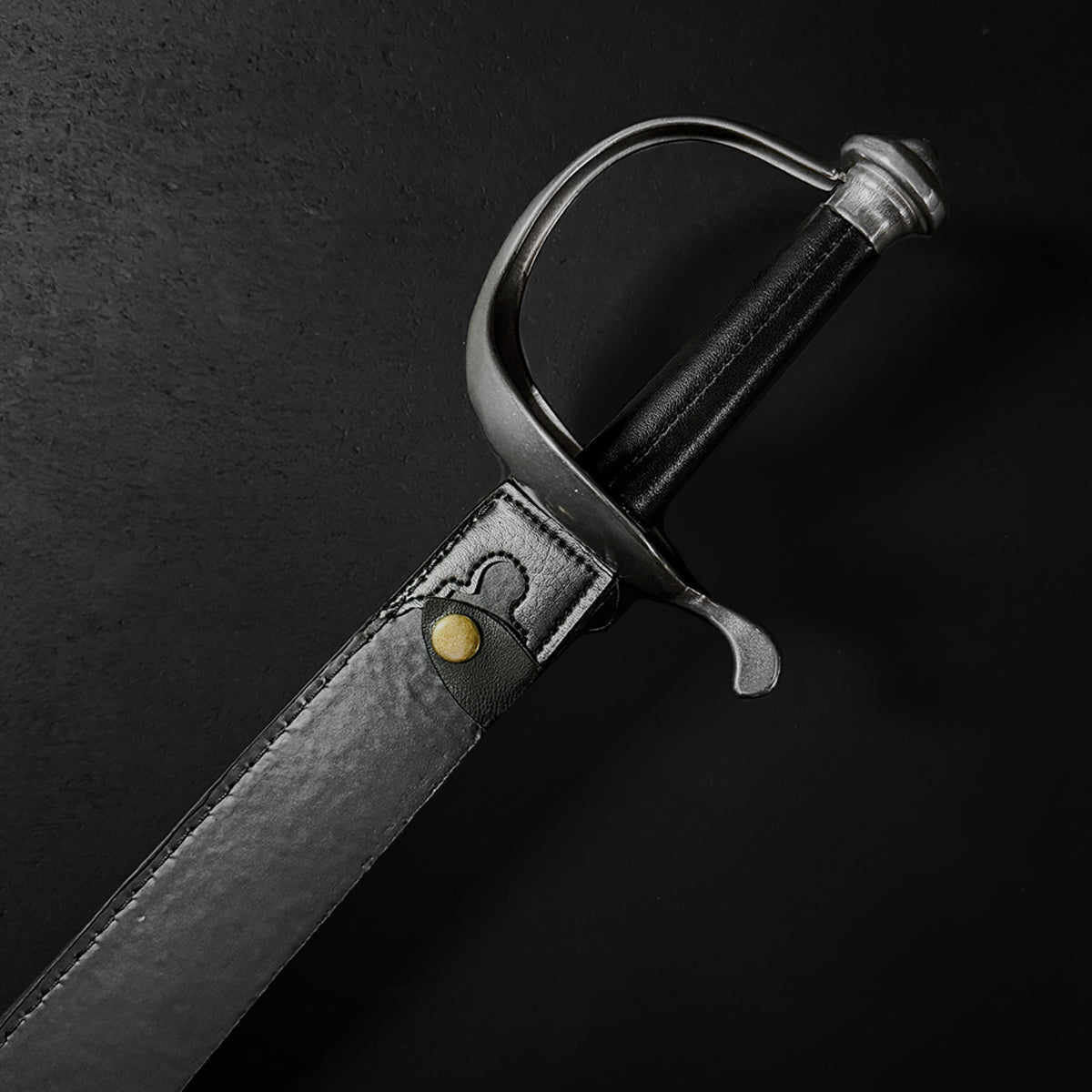 Close-up of a sheathed black cutlass | Knight's Collection
