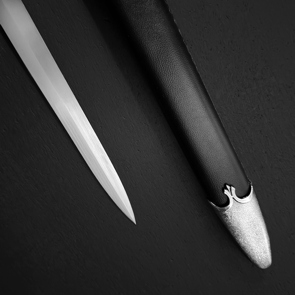 Steel blade next to leather scabbard | Knight's Collection