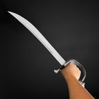 Hand holding a curved pirate cutlass | Knight's Collection