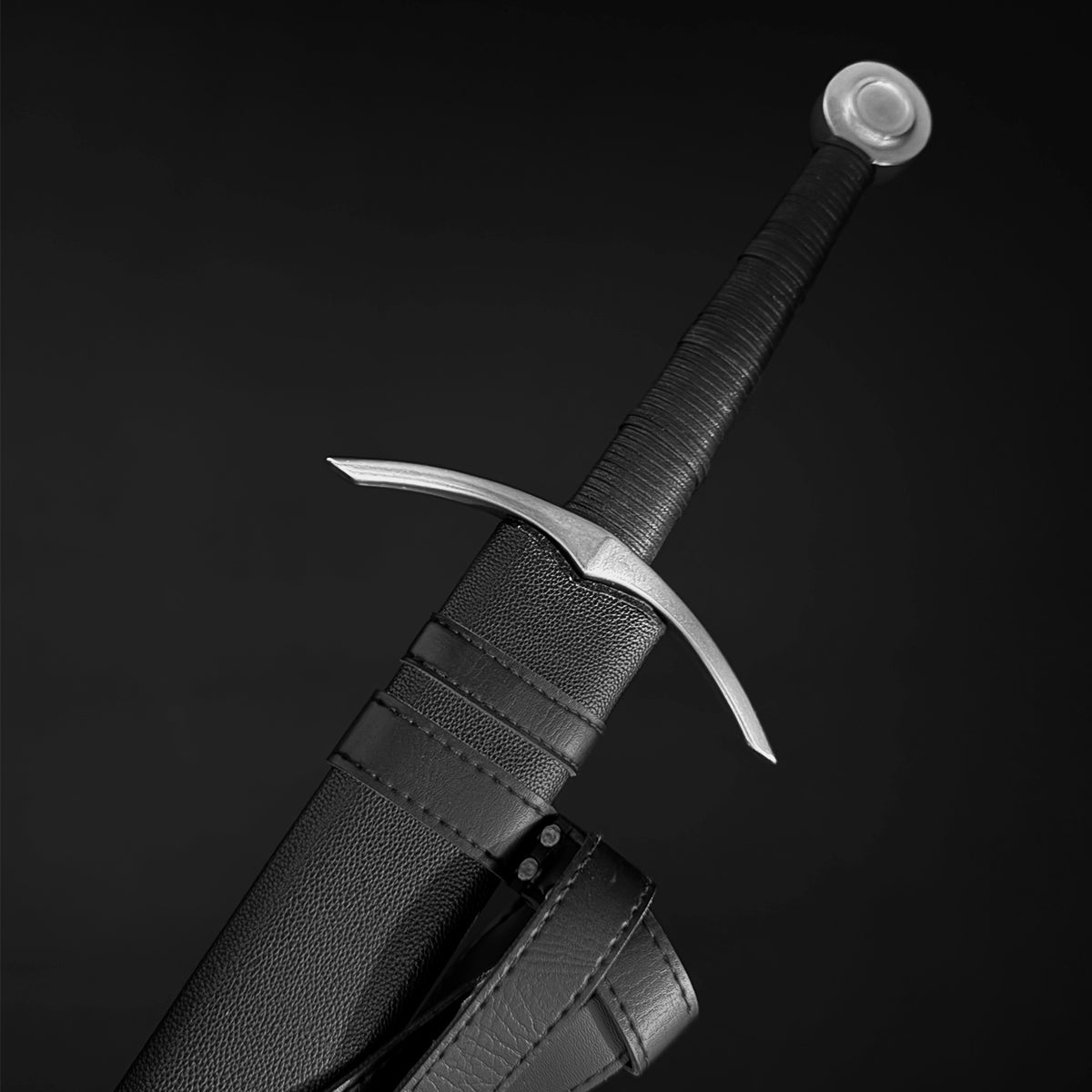 Medieval bastard sword with leather-wrapped grip and crossguard