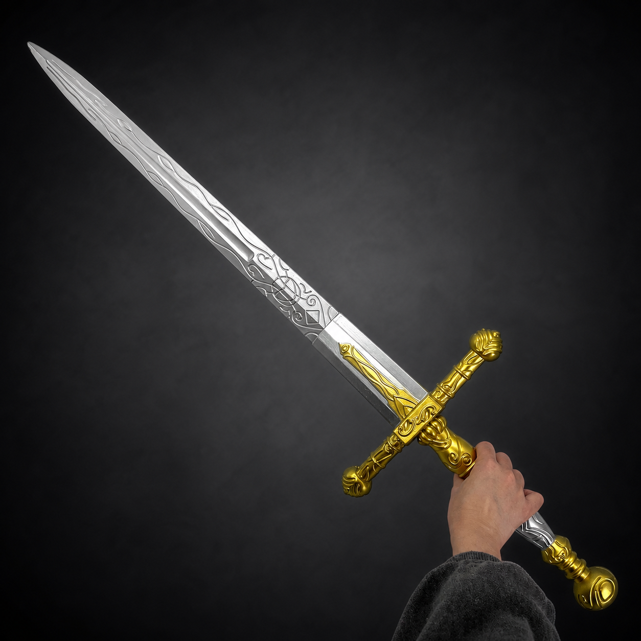 Hand holding golden sword | Knights Collection