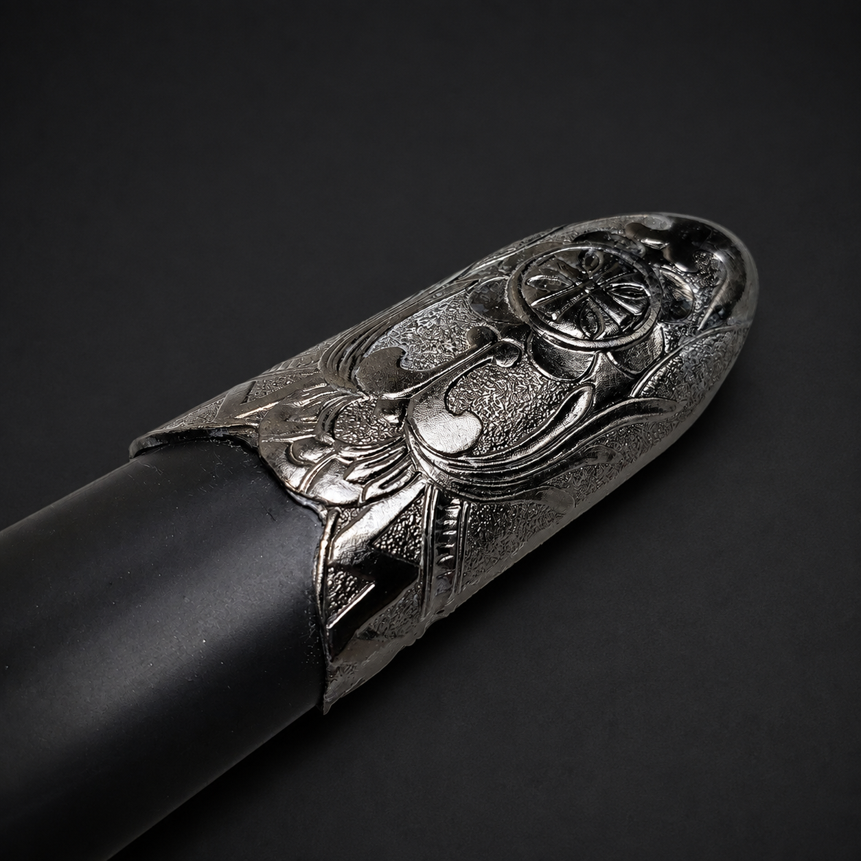 Decorative silver scabbard tip on sheath | Knight's Collection