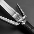 Amphisbaena medieval sword close up of triple fullered blade and angular crossguard with wrapped handle