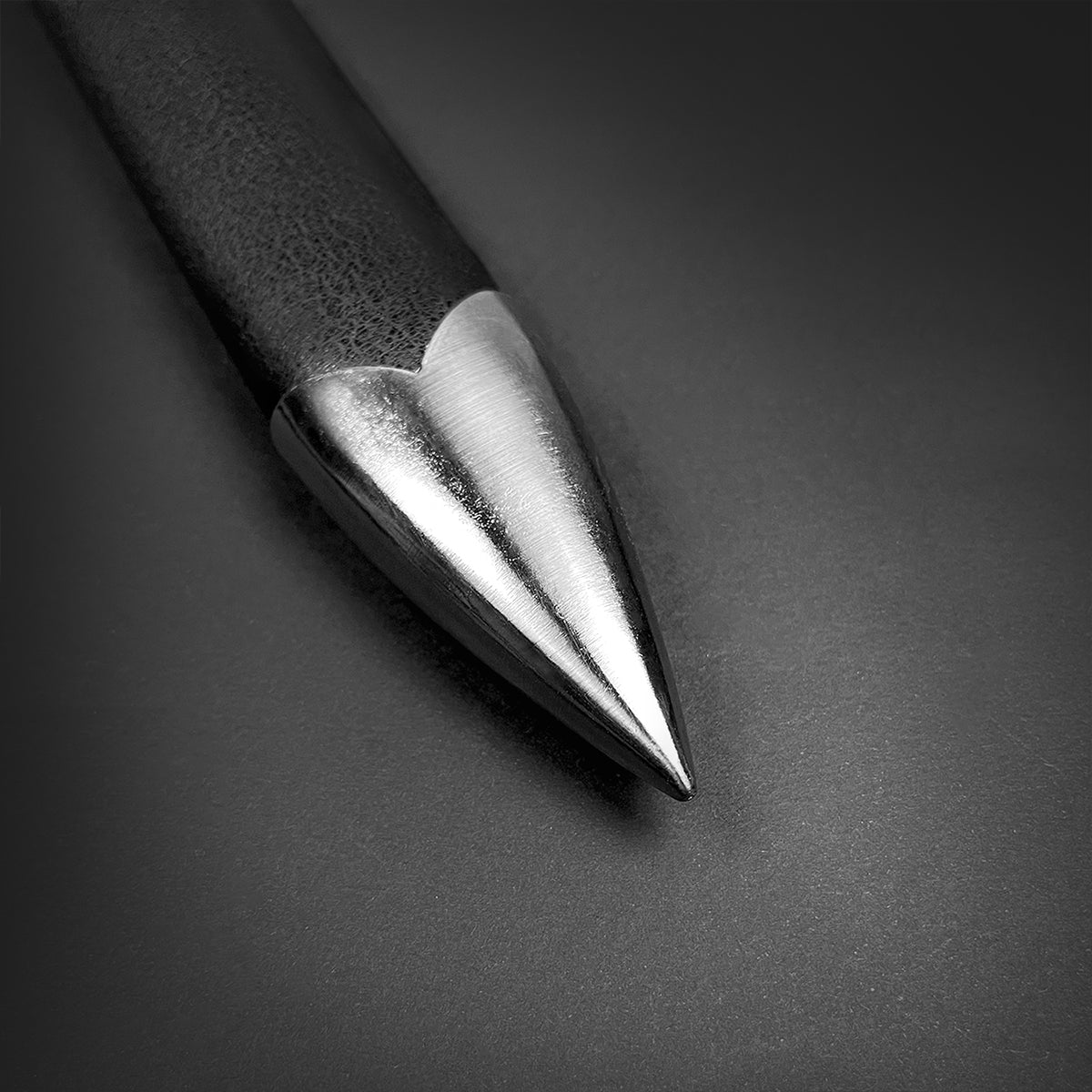 Knights Collection Amphisbaena medieval sword polished steel scabbard chape closeup on black leather