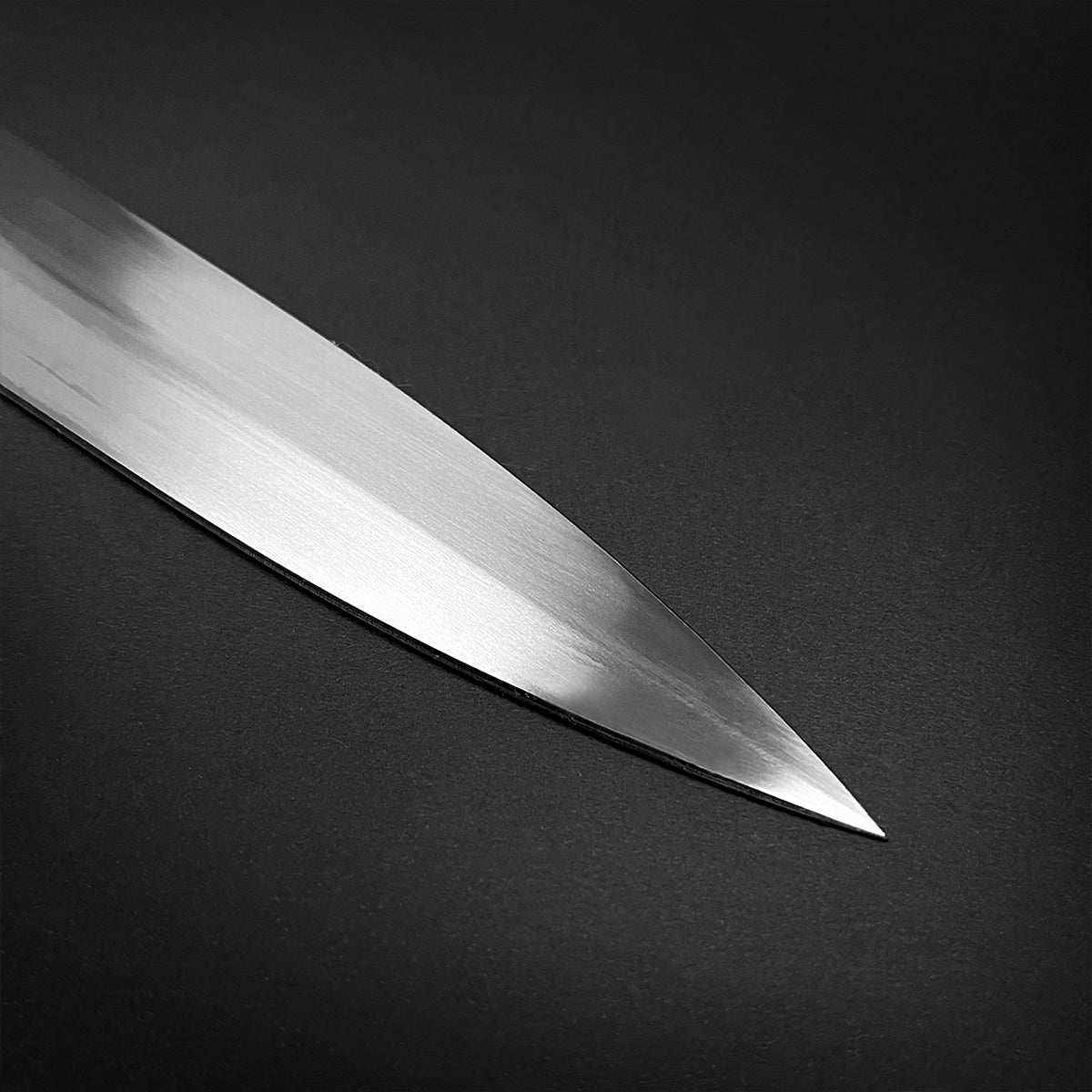 Sharp polished blade tip of a collector medieval sword replica from Knight's Collection