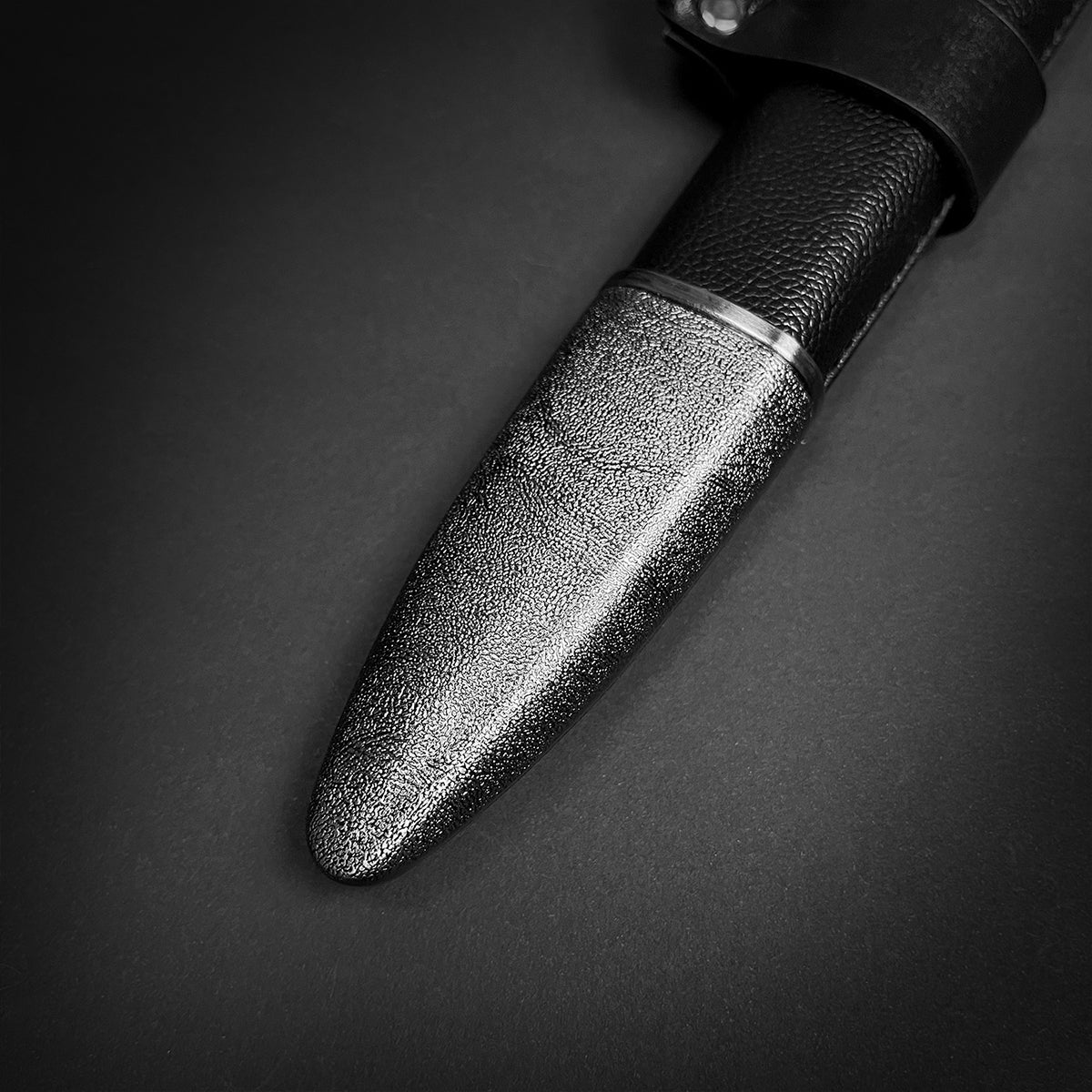 Close-up of textured black leather sheath from Knight's Collection collector medieval sword replica