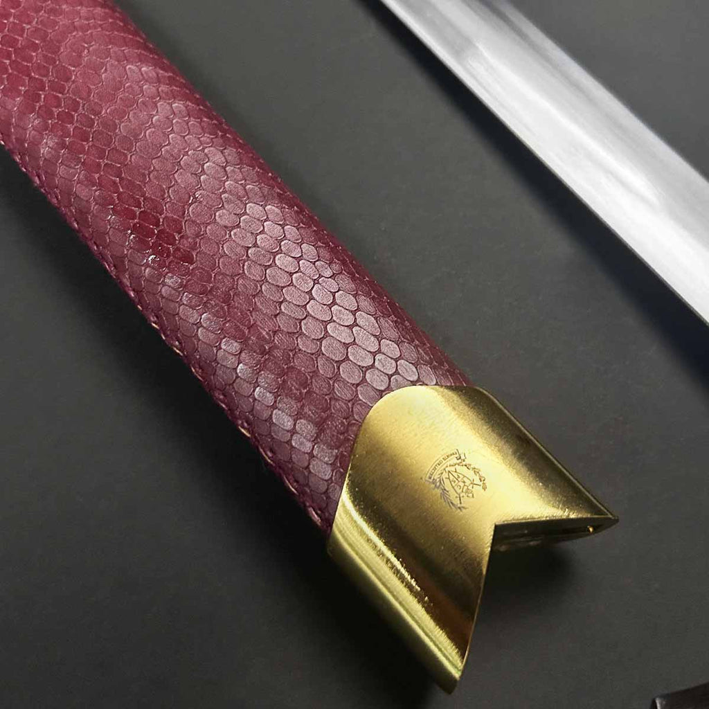 Close-up of the hilt and guard of Knight's Collection 'Chimera' Medieval Sword featuring a textured grip