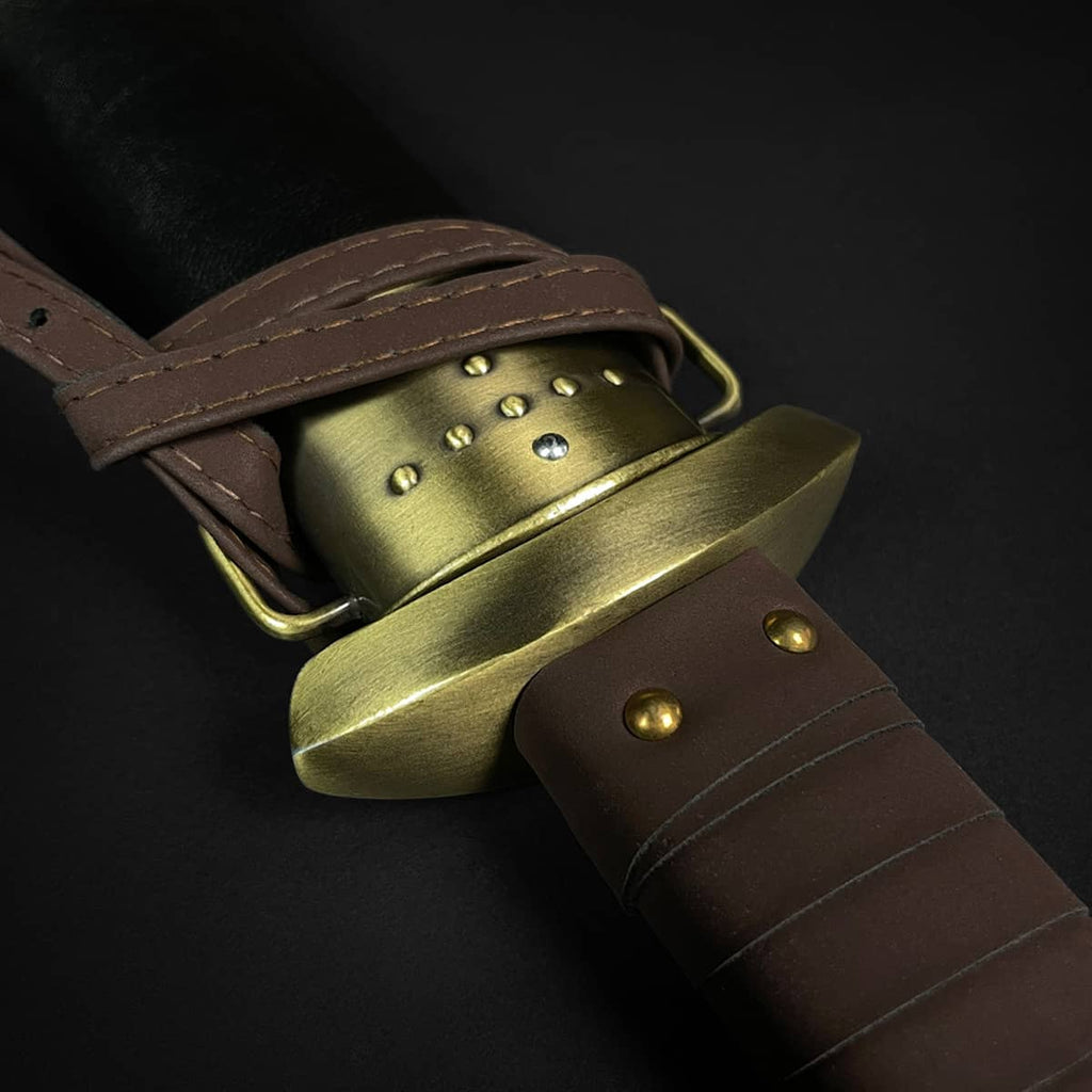 Knights Collection Godfrid the Battle-Born Viking Sword handle with brass guard and leather grip detail