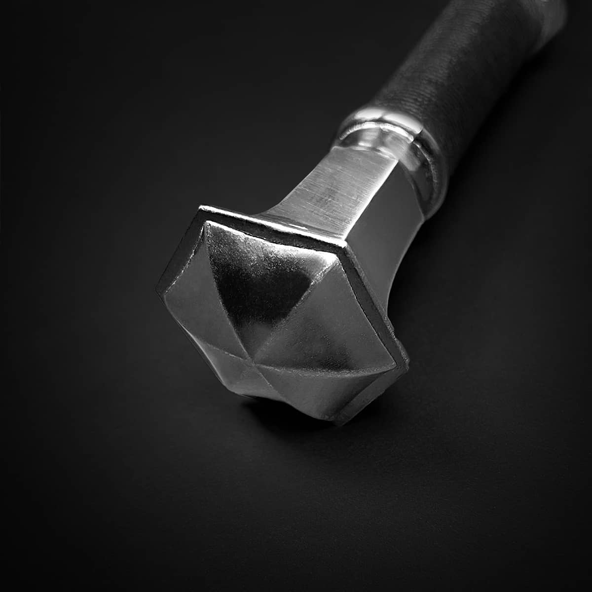 Detailed view of Knights Collection Nightwolf Medieval Sword hilt with unique design and grip