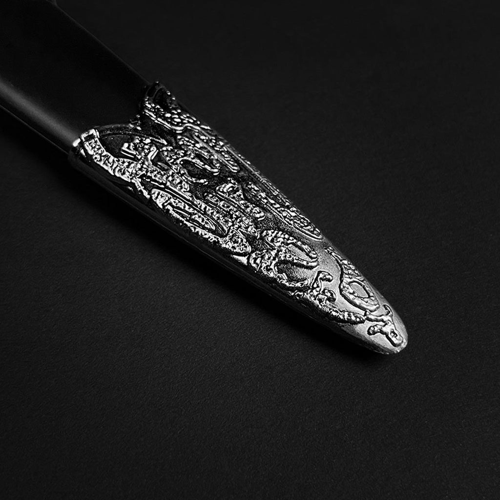 Close-up of a Medieval Dagger with Wolf Ornaments featuring intricate detailing on the blade