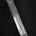 Knights Collection medieval sword for sale polished steel blade with gold rune inlay and partial hilt on black background