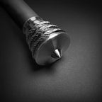 Close up metal pommel and braided grip detail of Knights Collection medieval sword for sale on dark background