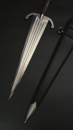 Medieval knight dagger with broad blade and black scabbard