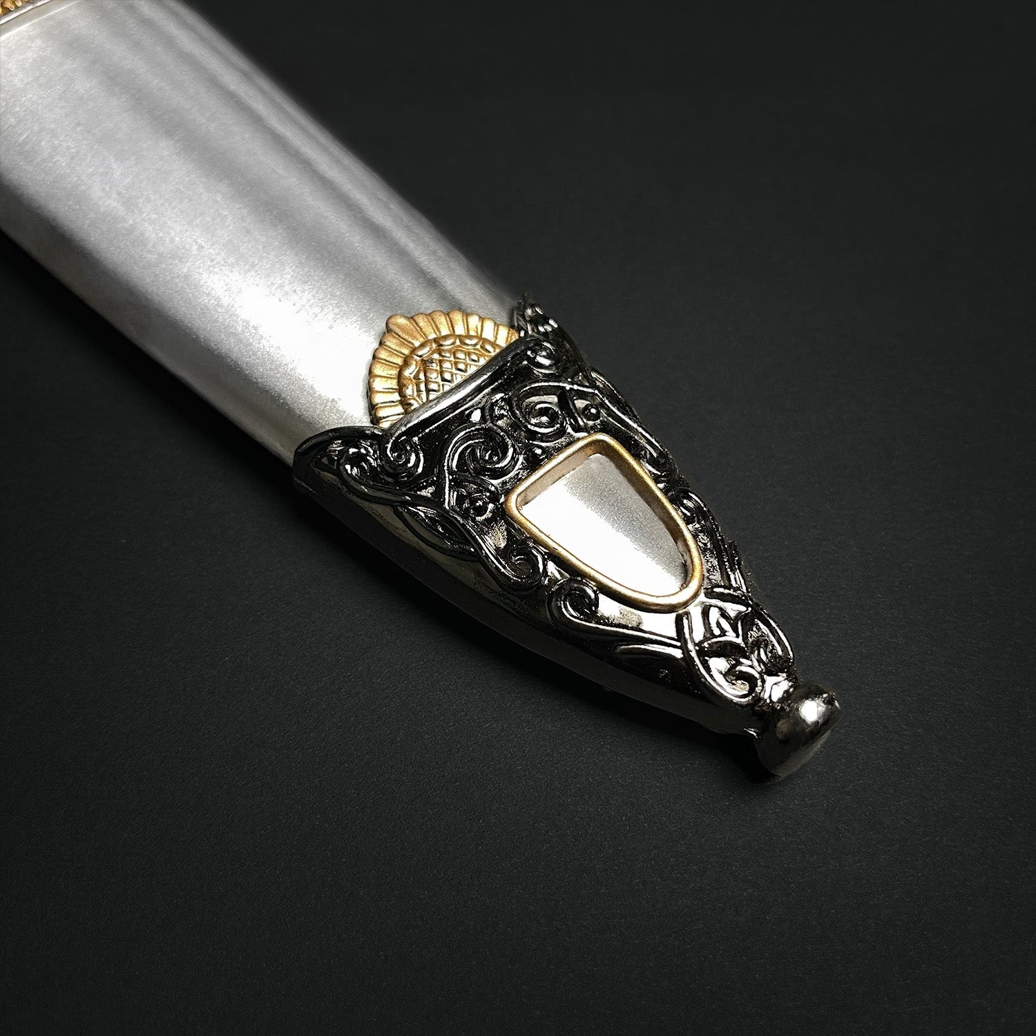 Roman Dagger with ornate silver handle and intricate gold detailing