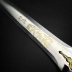 Roman Dagger with Blue Crystal Handle featuring intricate engravings on the blade