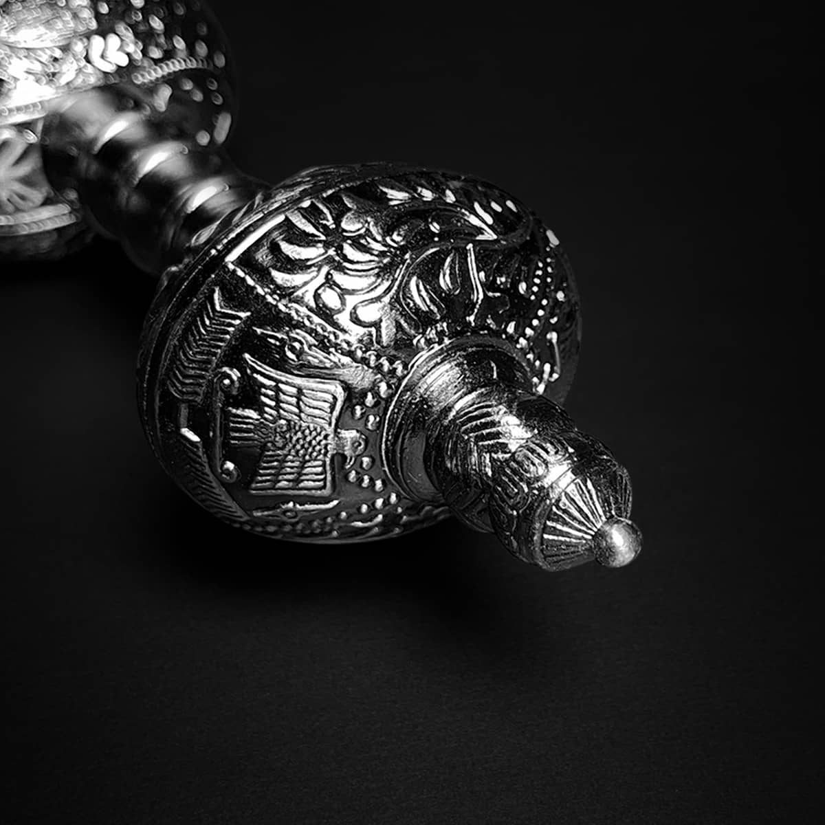 Ornate silver pommel and hilt detail of Knights Collection Roman Gladius Medieval Sword showcasing embossed decorative motifs