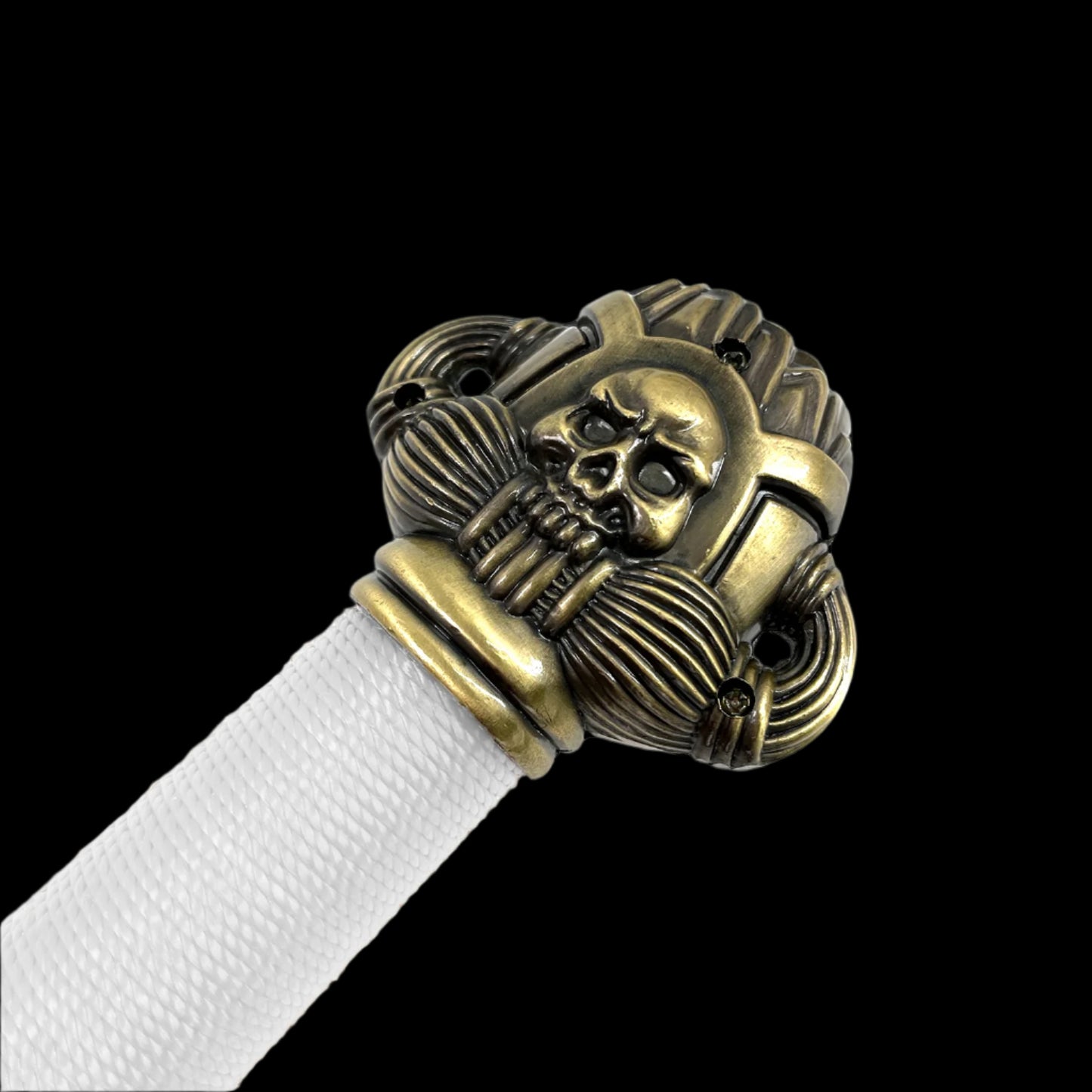 Close-up of decorative fantasy Barbarian sword handle with skull design and white grip from Knight's Collection