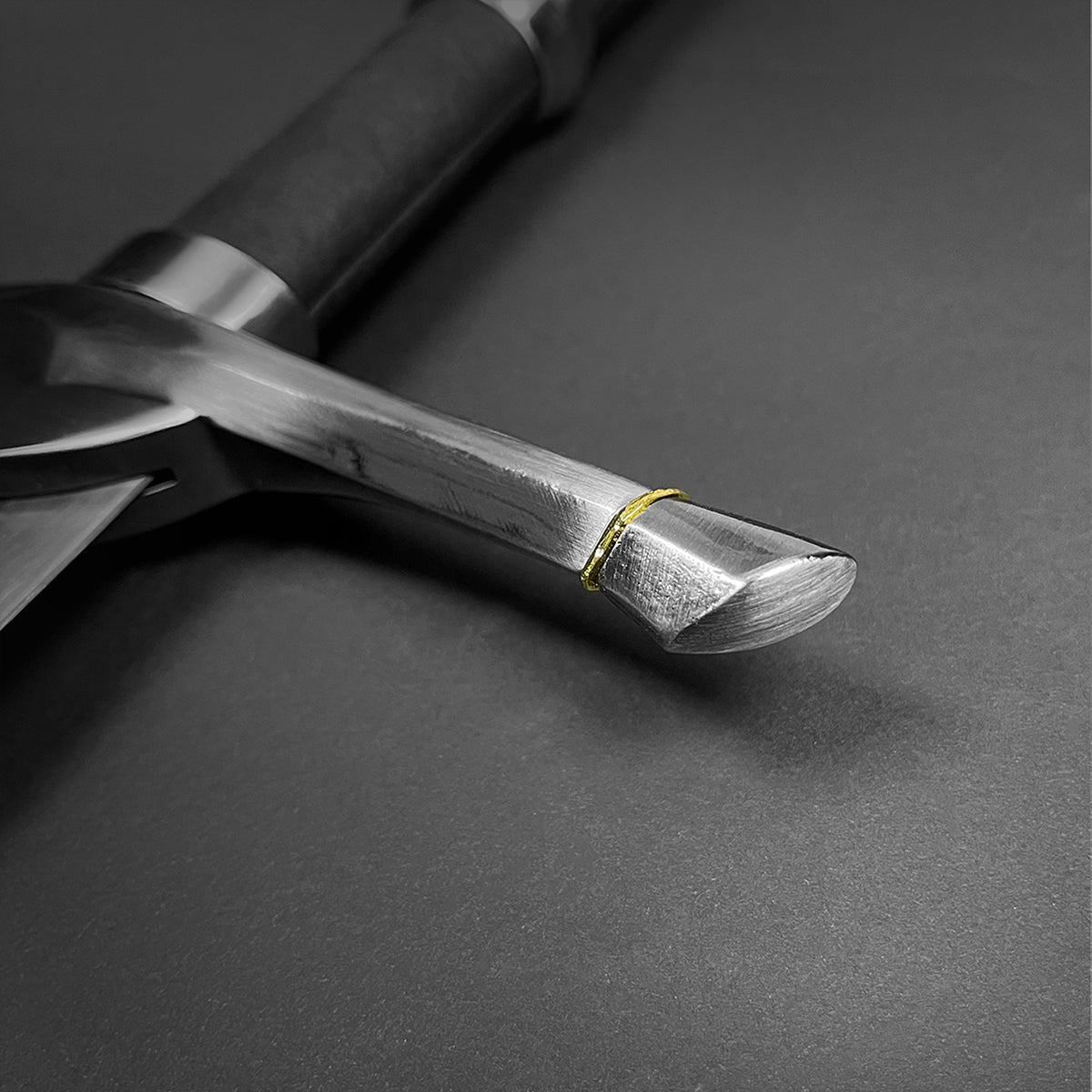 Close-up of Knight's Collection medieval sword for sale showing detailed metal guard and polished handle