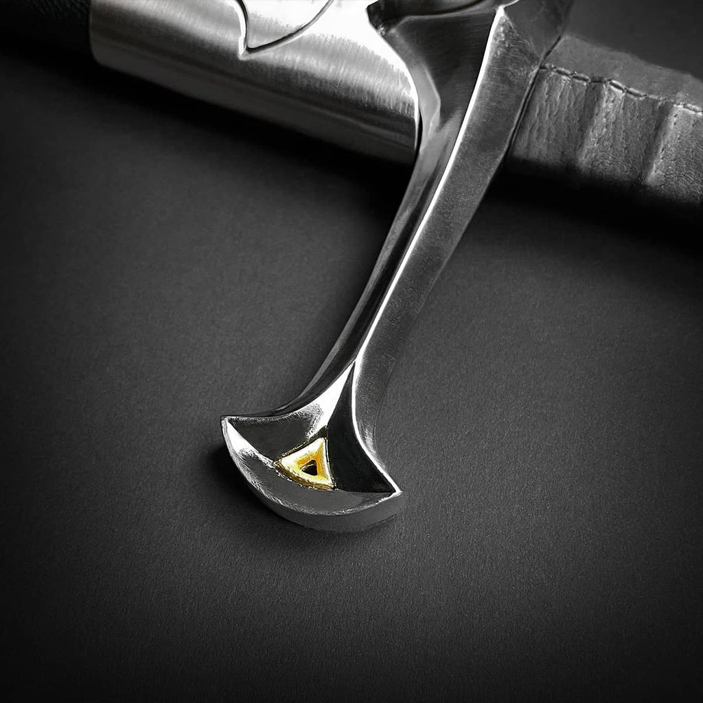Close-up of one hand medieval sword hilt with metallic silver finish and gold accent from Knight Collections
