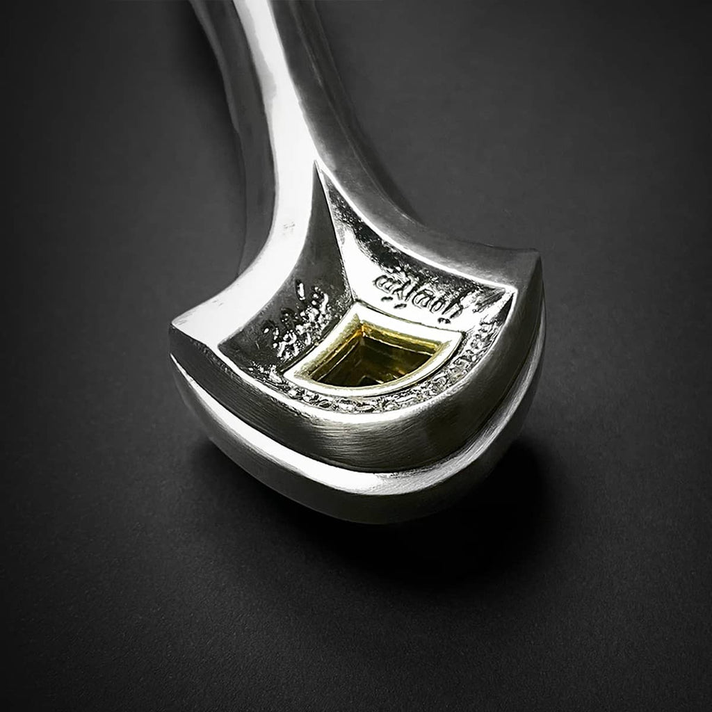 Close-up of ornate silver one hand medieval sword pommel with gold detailing by Knight Collections