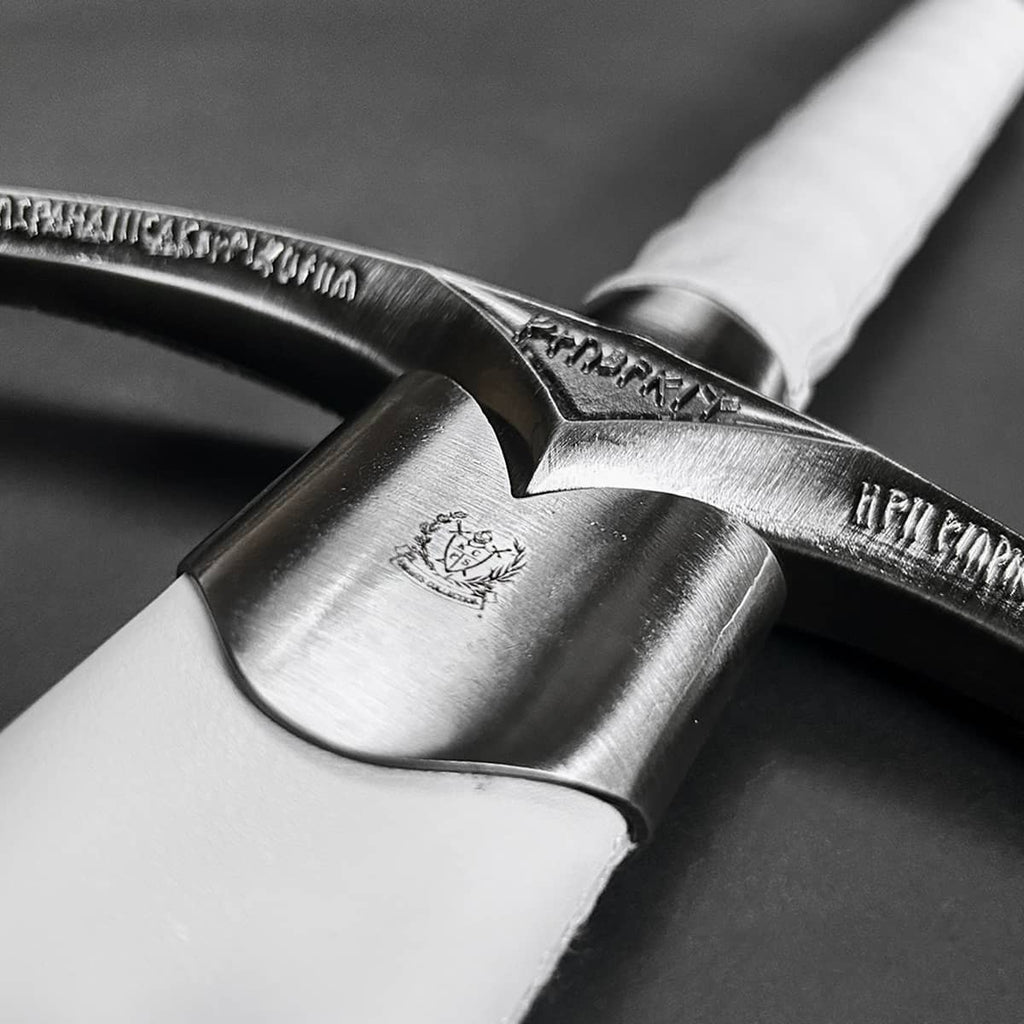 Close-up of a wizard's one-hand white medieval sword with intricate details and a polished handle